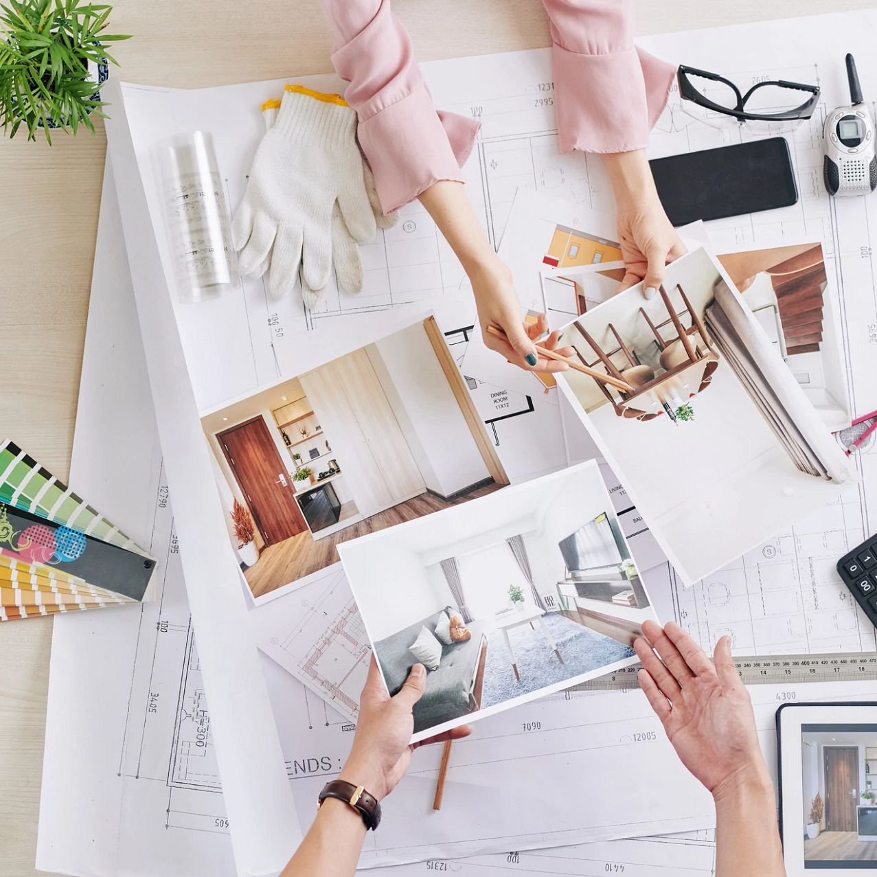 people looking at designs on a desk - Pritchett's Flooring Design Center in the Colonial Heights, VA area