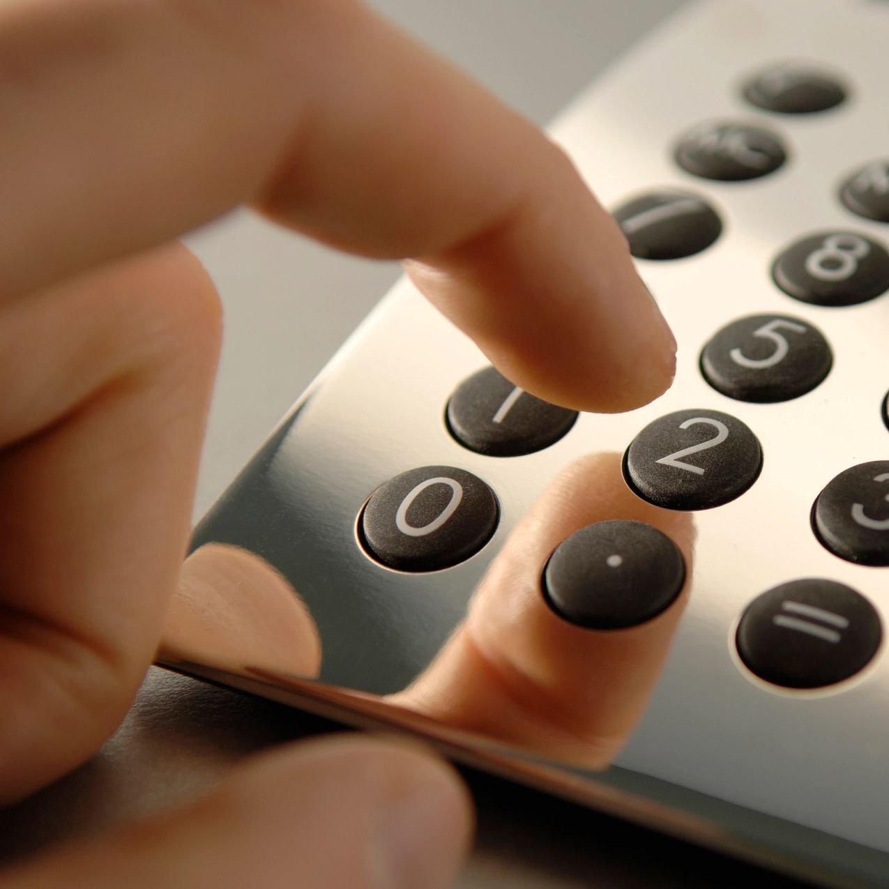 person using calculator. Finance options from Pritchett's Flooring Design Center in the Colonial Heights, VA area