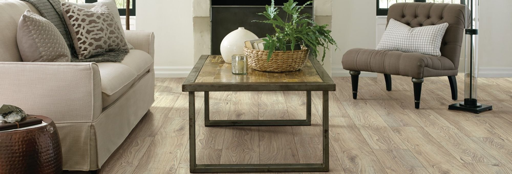 living room with wood-look laminate flooring from Pritchett's Flooring Design Center in the Colonial Heights, VA area